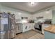 Bright kitchen featuring white cabinets, stainless steel appliances, and butcher block countertops at 3351 Londonderry Rd, North Charleston, SC 29420