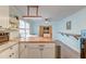 Bright eat-in kitchen with white cabinetry, butcher block countertops, and modern light fixtures at 3351 Londonderry Rd, North Charleston, SC 29420