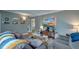 Comfortable living room with a large TV, plush seating, and a stylish glass coffee table at 3351 Londonderry Rd, North Charleston, SC 29420