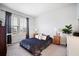 Bedroom with natural light, neutral walls, and a large window overlooking the neighborhood at 352 Great Lawn Dr, Summerville, SC 29486