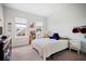 Well-lit bedroom with windows offering neighborhood views and bright white walls at 352 Great Lawn Dr, Summerville, SC 29486