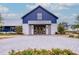 Attractive exterior view of the community clubhouse with paved entrance and landscaping at 352 Great Lawn Dr, Summerville, SC 29486