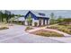 Exterior of clubhouse featuring nice landscaping and brick paver parking area at 352 Great Lawn Dr, Summerville, SC 29486