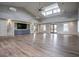Spacious clubhouse interior with hardwood floors, ample lighting, and large TV at 352 Great Lawn Dr, Summerville, SC 29486