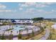 Stunning community pool with lounge chairs, palm trees, and scenic walking path at 352 Great Lawn Dr, Summerville, SC 29486