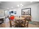 Bright dining area featuring a modern chandelier, stylish decor, and hardwood floors at 352 Great Lawn Dr, Summerville, SC 29486