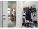 Organized entryway with shoe rack, wall-mounted hooks, and view of screened porch at 352 Great Lawn Dr, Summerville, SC 29486