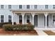Well maintained front exterior with a covered porch and neatly landscaped yard at 352 Great Lawn Dr, Summerville, SC 29486