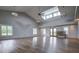 Bright, spacious hall featuring a high ceiling with modern ceiling fans and skylights at 352 Great Lawn Dr, Summerville, SC 29486