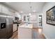 Well-lit kitchen boasts stainless steel appliances, granite countertops, and a center island at 352 Great Lawn Dr, Summerville, SC 29486