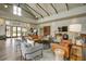 Bright lounge area featuring comfortable couches and chairs, wood floors, high ceilings, and modern decor at 352 Great Lawn Dr, Summerville, SC 29486
