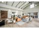 Bright lounge area showcasing chairs, couches, wood floors, high vaulted ceilings, and barn door at 352 Great Lawn Dr, Summerville, SC 29486
