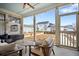 Relaxing screened-in porch with comfortable seating and a view of the backyard at 352 Great Lawn Dr, Summerville, SC 29486
