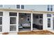 Relaxing screened-in porch with comfortable seating and outdoor decor at 352 Great Lawn Dr, Summerville, SC 29486