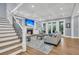 Cozy living room with a brick fireplace, coffered ceilings, and access to an outdoor patio at 3736 Goodwater St, Mount Pleasant, SC 29466