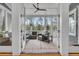 Relaxing screened porch with comfortable wicker furniture and scenic outdoor views at 3736 Goodwater St, Mount Pleasant, SC 29466