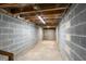 Spacious unfinished basement with concrete walls and exposed ceiling at 38 Elliott St, Charleston, SC 29401