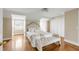 Bright bedroom featuring a plush bed, window seat, and hardwood floors at 38 Elliott St, Charleston, SC 29401