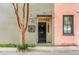 Charming home exterior featuring a black front door, vintage-style lantern, and manicured landscaping at 38 Elliott St, Charleston, SC 29401