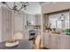 Elegant kitchen and dining area featuring stainless steel appliances and custom cabinetry at 38 Elliott St, Charleston, SC 29401