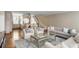 Spacious living room with hardwood floors, neutral sofas, connecting the dining area and kitchen at 38 Elliott St, Charleston, SC 29401