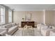 Sunlit living room featuring neutral furniture, hardwood floors, and decorative accents creating a welcoming atmosphere at 38 Elliott St, Charleston, SC 29401