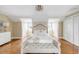 Spacious main bedroom with a bench at the end of the bed and storage in built-in nooks at 38 Elliott St, Charleston, SC 29401