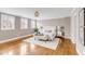 Spacious main bedroom featuring hardwood floors, a decorative rug, and neutral walls at 38 Elliott St, Charleston, SC 29401