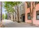 Charming historic street featuring colorful townhouses and mature trees at 38 Elliott St, Charleston, SC 29401