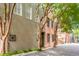 Picturesque street with historic homes shaded by trees and unique architecture at 38 Elliott St, Charleston, SC 29401