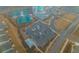 An aerial view of a community clubhouse with a large parking lot, swimming pool and tennis courts at 402 Switchgrass Dr, Summerville, SC 29486