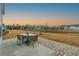Backyard features a patio with a table set and a view of the pond at 402 Switchgrass Dr, Summerville, SC 29486