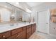 Bathroom with a double vanity, large mirror, and modern finishes at 402 Switchgrass Dr, Summerville, SC 29486