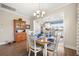 Elegant dining room next to an open kitchen, featuring hardwood floors, stylish decor, and natural light for inviting meals at 402 Switchgrass Dr, Summerville, SC 29486
