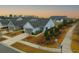 Beautiful single-Gathering home featuring a well-manicured lawn, mature trees, and an inviting facade in a suburban neighborhood at 402 Switchgrass Dr, Summerville, SC 29486