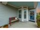 Cozy front porch featuring a bench, tasteful decor, and charming home details at 402 Switchgrass Dr, Summerville, SC 29486