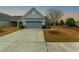 Charming home with a two-car garage and well manicured lawn at 402 Switchgrass Dr, Summerville, SC 29486