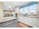 Open kitchen featuring white cabinets, stainless steel appliances and large windows at 402 Switchgrass Dr, Summerville, SC 29486