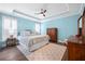 Spacious main bedroom with a tray ceiling and natural light at 402 Switchgrass Dr, Summerville, SC 29486