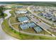 Aerial view of community tennis and basketball courts, walking paths, and neighborhood at 46 Clearblue Loop, Summerville, SC 29486