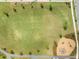 Aerial view of park and playground with green space, walking paths, and playground equipment at 46 Clearblue Loop, Summerville, SC 29486
