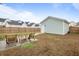 Backyard featuring a detached shed, chairs, and newly installed wooden fence at 46 Clearblue Loop, Summerville, SC 29486