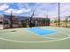Outdoor basketball court with new surface, hoop and fence in a well maintained neighborhood at 46 Clearblue Loop, Summerville, SC 29486