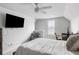 Bright bedroom with large TV, ceiling fan, sitting area, and desk space at 46 Clearblue Loop, Summerville, SC 29486