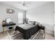 Bedroom showcasing a black bed, a desk and mirror, and a black and white patterned rug at 46 Clearblue Loop, Summerville, SC 29486