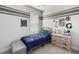 A bedroom with gray and white stripes, bed, dresser, and decorative letters on the wall at 46 Clearblue Loop, Summerville, SC 29486