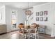 Bright dining area featuring an eye-catching light fixture and a view to the outdoor patio at 46 Clearblue Loop, Summerville, SC 29486