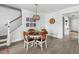 Cozy dining area with a round table, stylish chandelier, and staircase access at 46 Clearblue Loop, Summerville, SC 29486