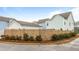 Exterior view of community home with beautiful landscaping and a privacy fence at 46 Clearblue Loop, Summerville, SC 29486