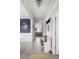 Bright and open hallway featuring detailed moulding, modern light fixtures, and hardwood floors at 46 Clearblue Loop, Summerville, SC 29486